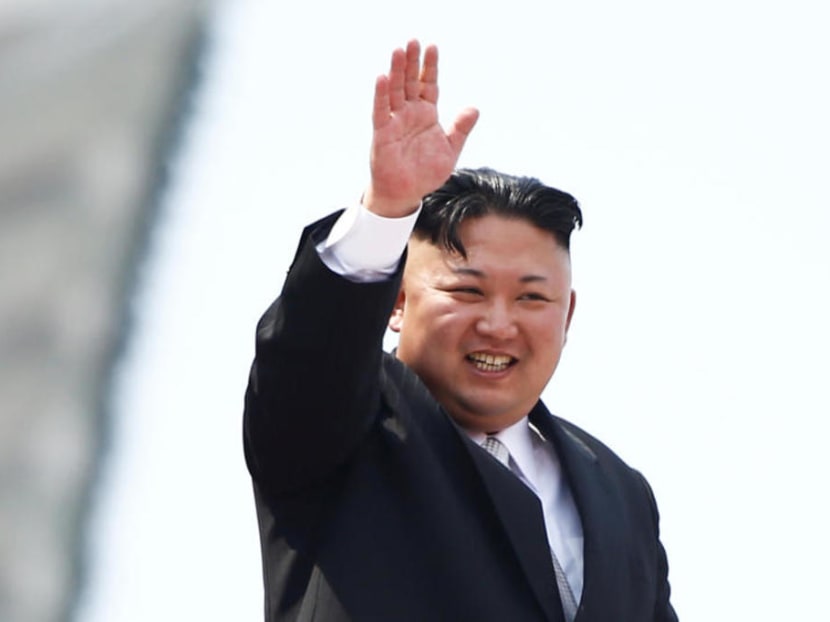 North Korean leader Kim Jong Un waves to people attending a military parade marking the 105th birth anniversary of country's founding father, Kim Il Sung in Pyongyang in April 2017.
