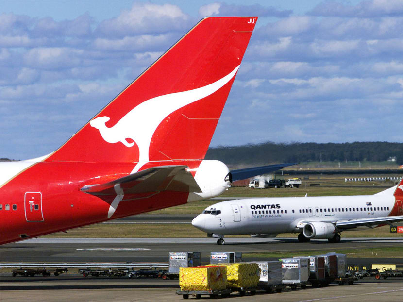 Qantas aircrafts at Sydney International Airport. Qantas will be increasing its existing daily flight from Melbourne to Singapore, by using the larger Airbus A380. Photo: AFP