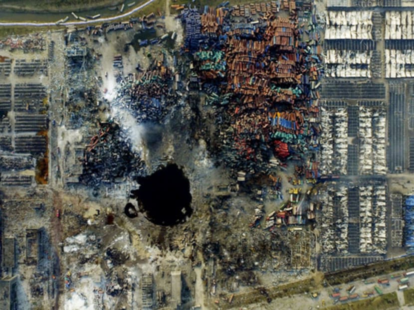 An aerial photo of the site of the explosions at the industrial plant and nearby residential areas in the Binhai new district in Tianjin, China. Photo: Reuters