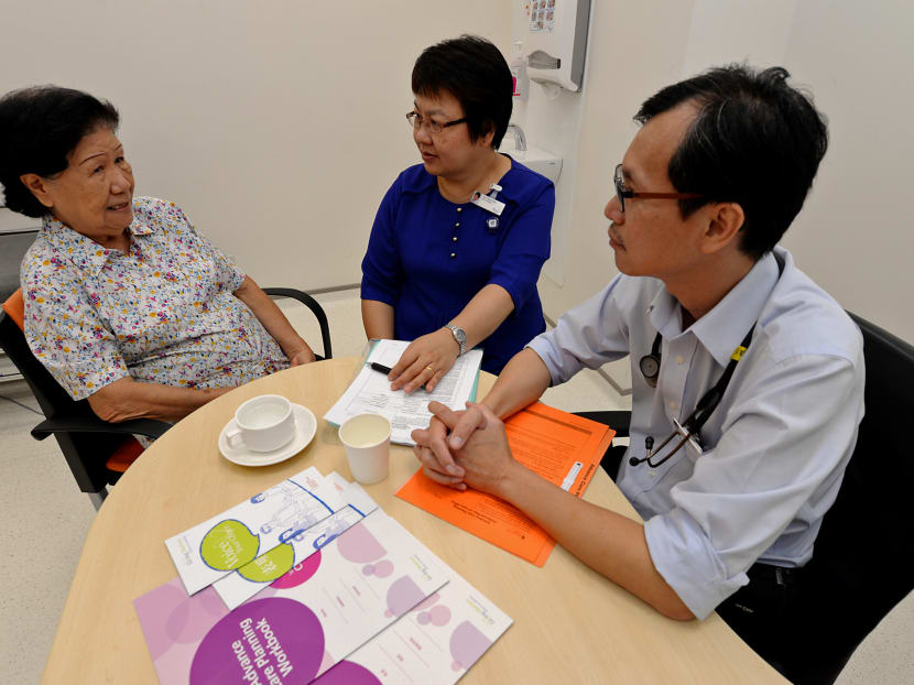Madam Eunice Ang (Left), 83, discussing death and care plans with Advance Care Planning Facilitator Ms Tan Seng Wah (Centre) and Dr Siew Chee Weng (Right), Department of Geriatric Medicine Khoo Teck Puat Hospital. Photo: Robin Choo