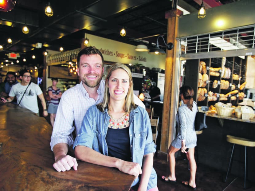 Owners John Rife (left) and his wife Kamrin pose for a photo in the East End Market, a neighborhood market and cultural food hub inspired by local farmers and food artisans in Orlando. Photo: AP
