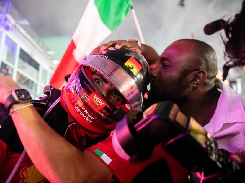 Ferrari's Carlos Sainz celebrates after winning the Singapore Grand Prix on Sept 17, 2023. 