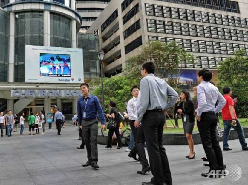 Office workers at lunch break at a financial district in Singapore. Photo: Channel Newsasia