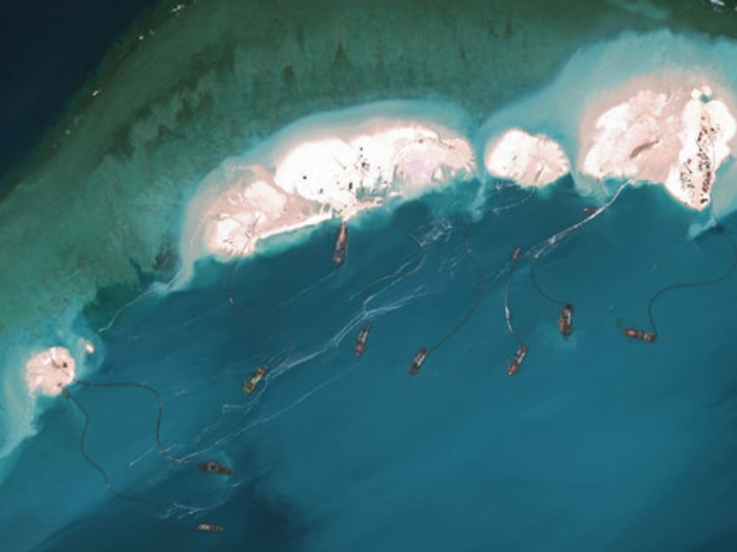 DigitalGlobe imagery from March 16, 2015 shows significant construction and dredging underway at Mischief Reef. Photo: Getty Images