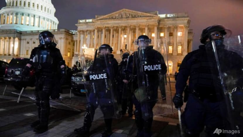 US Congress reconvenes to certify Biden win after protesters invaded Capitol