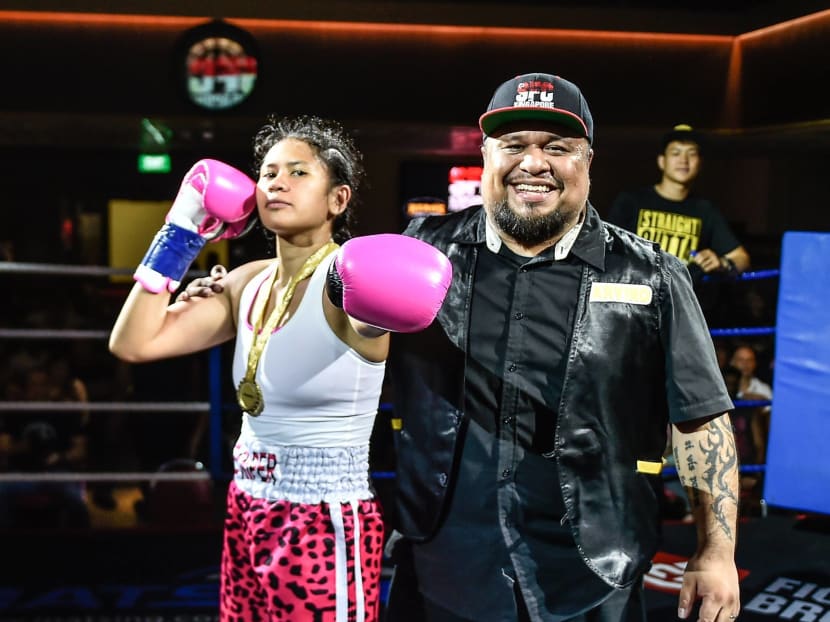 Nurshahidah Roslie with her coach Arvind Lalwani. Photo: Singapore Fighting Championship Facebook page