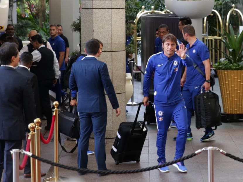 Chelsea manager Antonio Conte was the sixth person to step out of the bus when it arrived at the Ritz-Carlton Hotel, and the charismatic Italian, decked in a blue tracksuit, gave a big smile and wave to the fans. Photo: Wee Teck Hian/TODAY