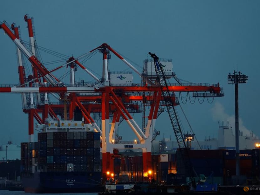 FILE PHOTO: A cargo ship and containers are seen at an industrial port in Tokyo, Japan, February 15, 2022. REUTERS/Kim Kyung-Hoon/File Photo FILE PHOTO: A cargo ship and containers are seen at an industrial port in Tokyo, Japan, February 15, 2022. REUTERS/Kim Kyung-Hoon/File Photo