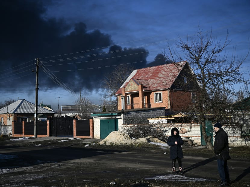Black smoke rises from a military airport in Chuguyev, near Kharkiv in northeast Ukraine, on February 24, 2022. 
