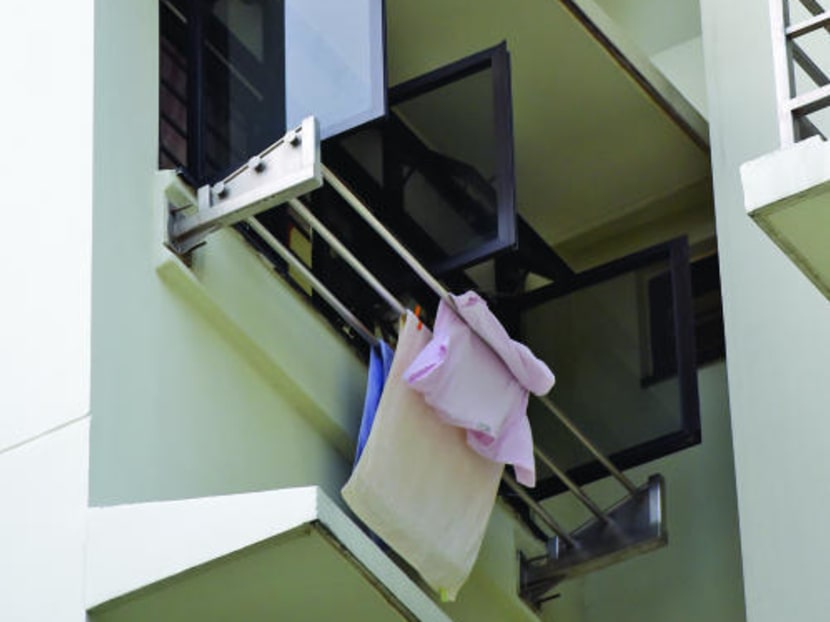 External clothes drying racks seen at a block in Toa Payoh. These are allegedly patented designs of a 54-year-old inventor who is suing the Housing and Development Board (HDB) for infringing his patent for a clothes-drying rack, but the statutory board rejects the claim and is seeking to revoke the patent granted to him in 2004. Photo: Ooi Boon Keong