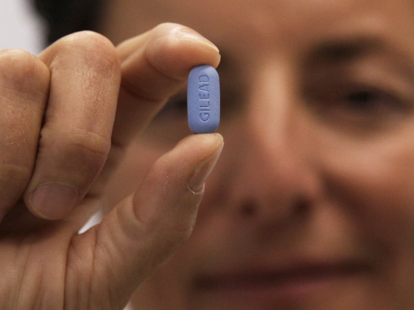Dr Lisa Sterman holds up a Truvada pill, an HIV treatment pill used to prevent infection in people at high risk of getting the AIDS virus, at her office in San Francisco. Photo: AP