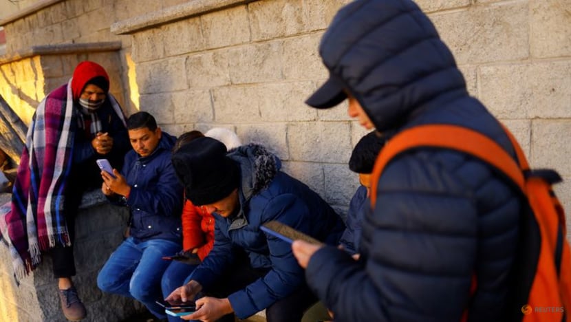 Struggling with US asylum app, migrant families split at border