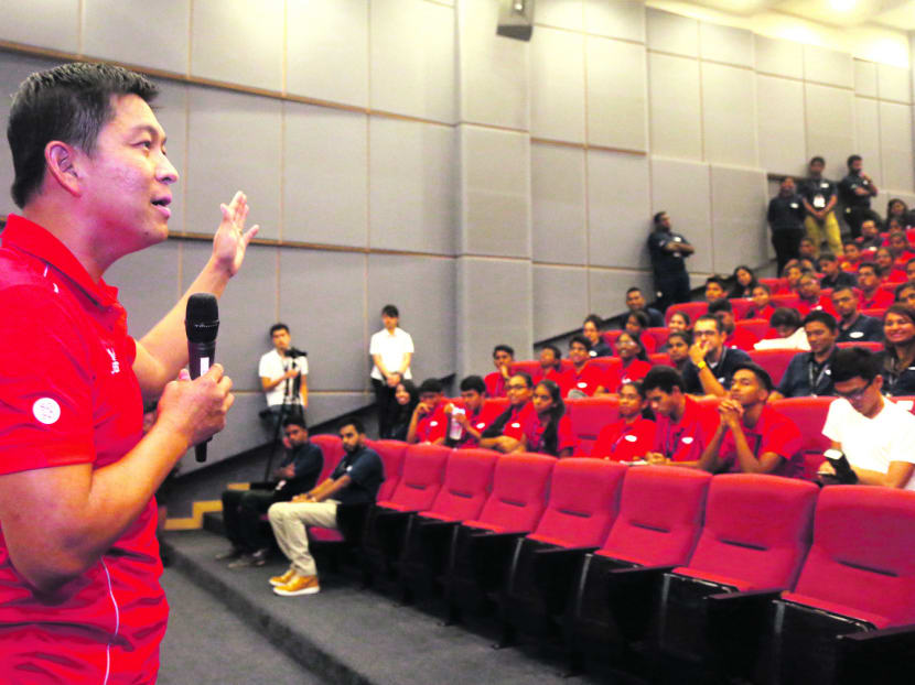 Mr Tan Chuan-Jin (left), speaking at the SINDA Youth Leaders seminar, said help is available for single mothers, but he wondered if preventive measures could also be taken. Photo: Ooi Boon Keong