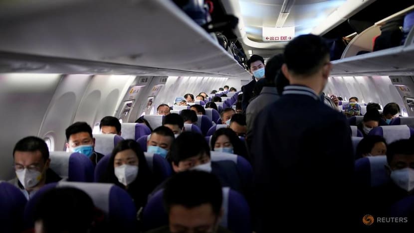 China cuts international flights, bars foreign residents