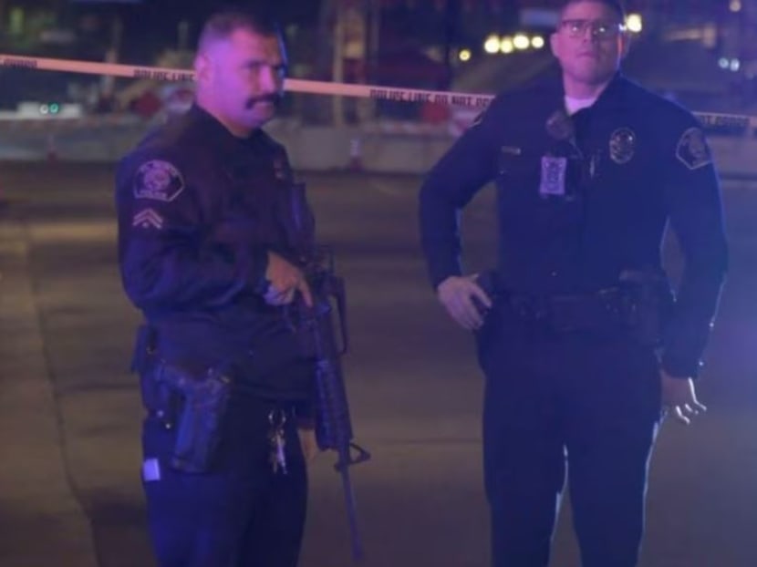 Screenshot from a viodeo shows police officers standing guard at the scene of a shooting at Monterey Park, California, US Jan 22, 2023. Screenshot from a viodeo shows police officers standing guard at the scene of a shooting at Monterey Park, California, US Jan 22, 2023.