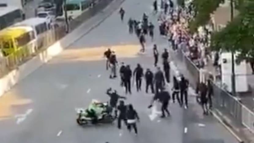 Hong Kong cop suspended after driving motorbike into group of protesters