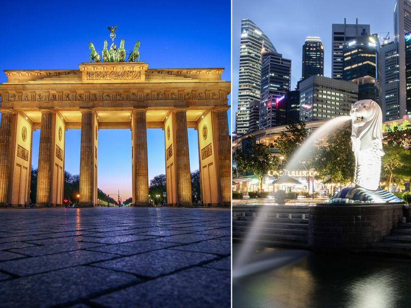 The Brandenburg Gate monument in Berlin, Germany (left) and the Merlion Park at the Marina Bay area in Singapore (right).