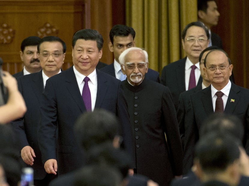 (From left): Chinese Premier  Li Keqiang, Chinese President Xi Jinping, Indian Vice-President Hamid Ansari and Myanmar President Thein Sein at the Great Hall of the People in Beijing on Saturday. Photo: AP
