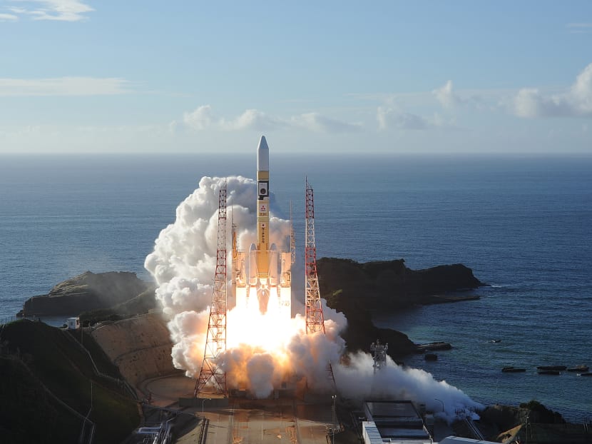 In this handout photograph taken and released on July 20, 2020 by Mitsubishi Heavy Industries an H-2A rocket carrying the Hope Probe known as "Al-Amal" in Arabic, developed by the Mohammed Bin Rashid Space Centre in the United Arab Emirates to explore Mars, blasts off from Tanegashima Space Centre in southwestern Japan.