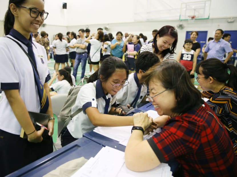 Students react as they receive their GCE O-Level results on Monday (Jan 14). For the second time in nearly a year, national examination scripts sent to the United Kingdom for grading have gone missing.
