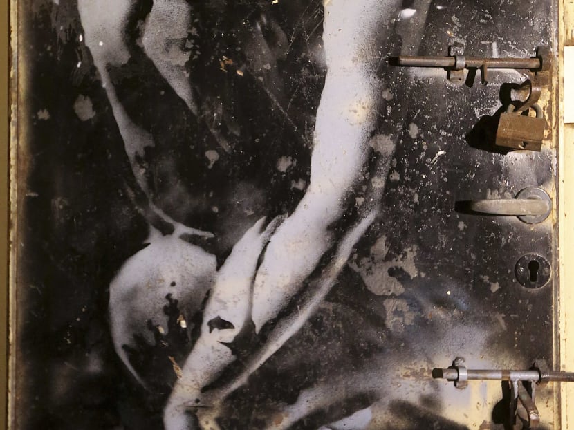 Gaza artist gobbles up valuable Banksy mural on war debris