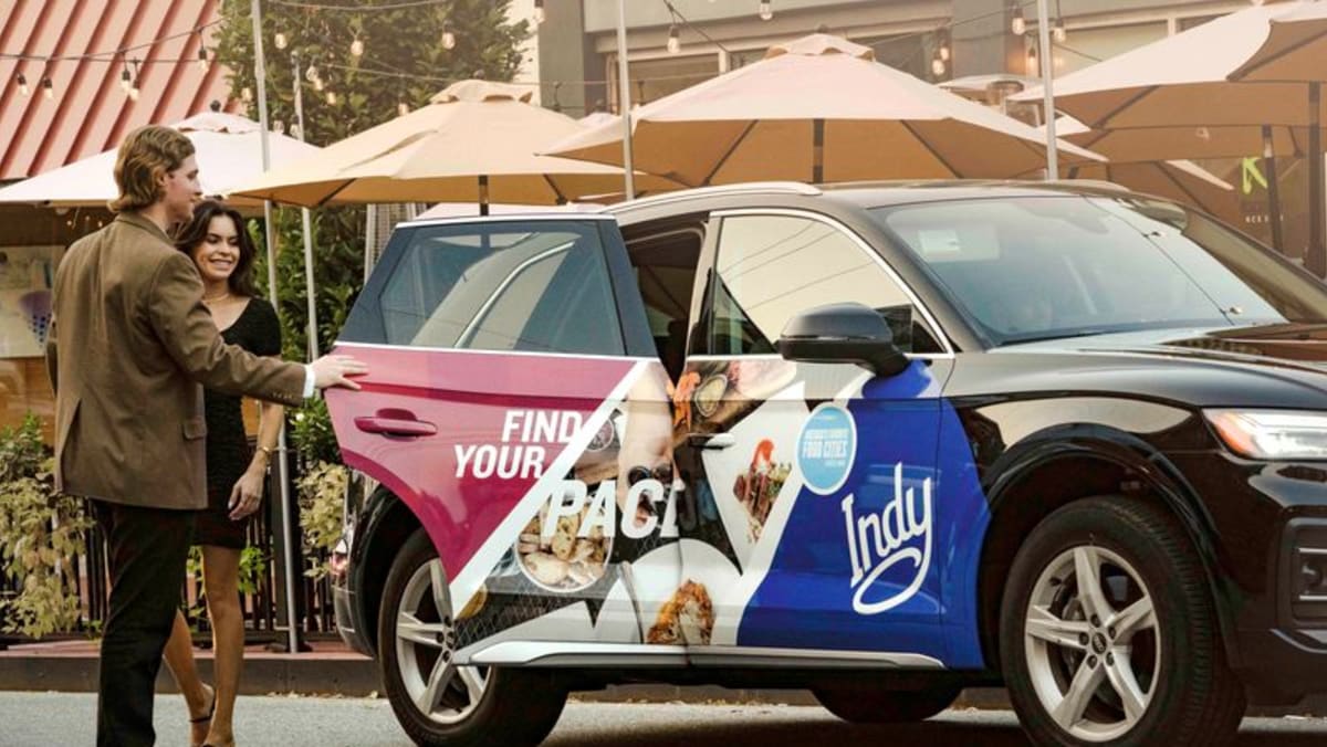 Gas at $5 tips some US rideshare drivers to wrap cars in ads