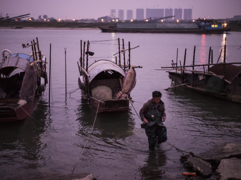 Gallery: In China, an Ancient people watch their floating life dissolvew