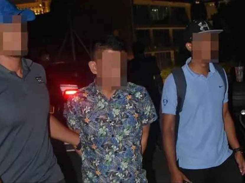 Mohamed Kazali Salleh (centre) was arrested in Malaysia by the Malaysian Special Branch in December 2018.