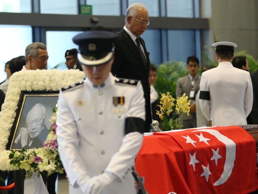 Malaysian Prime Minister Najib Razak pays respects to the late Mr Lee Kuan Yew who is lying in state at Parliament House. Photo: TODAY/ Wee Teck Hian