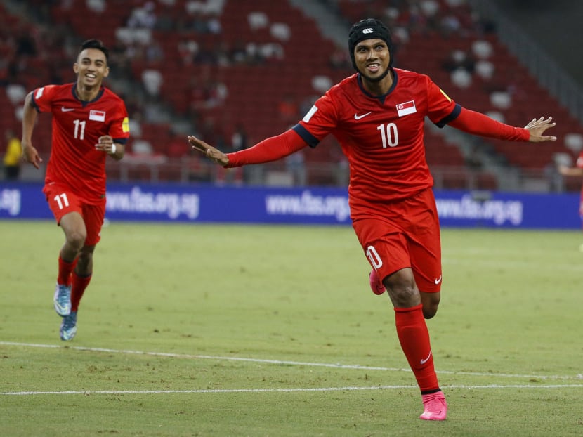 Singapore's Fazrul Nawaz (10) celebrates after scoring their second goal against Cambodia during their 2018 World Cup Group E qualifying soccer match at the National Stadium in Singapore October 13, 2015. Photo: Reuters