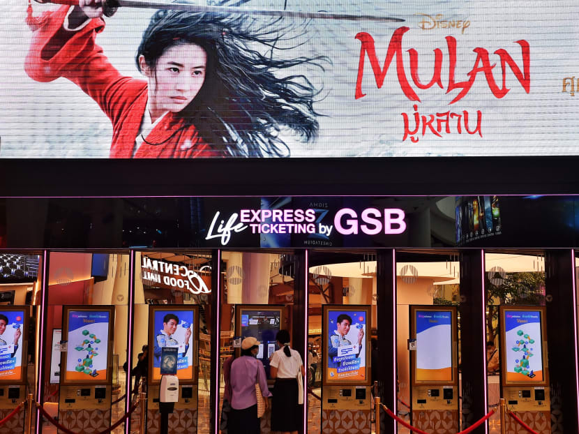 People buy tickets for Disney’s Mulan film at a cinema inside a shopping mall in Bangkok on Sept 8, 2020.