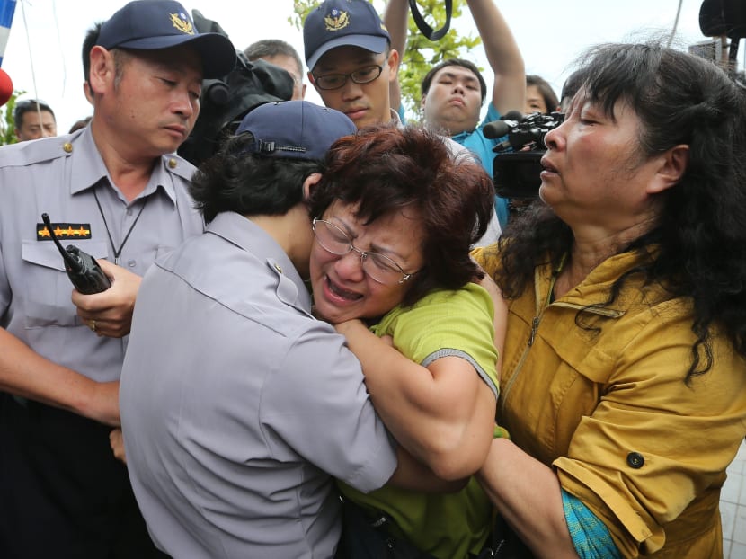 Gallery: Relatives fly to Taiwan plane crash site, 48 dead