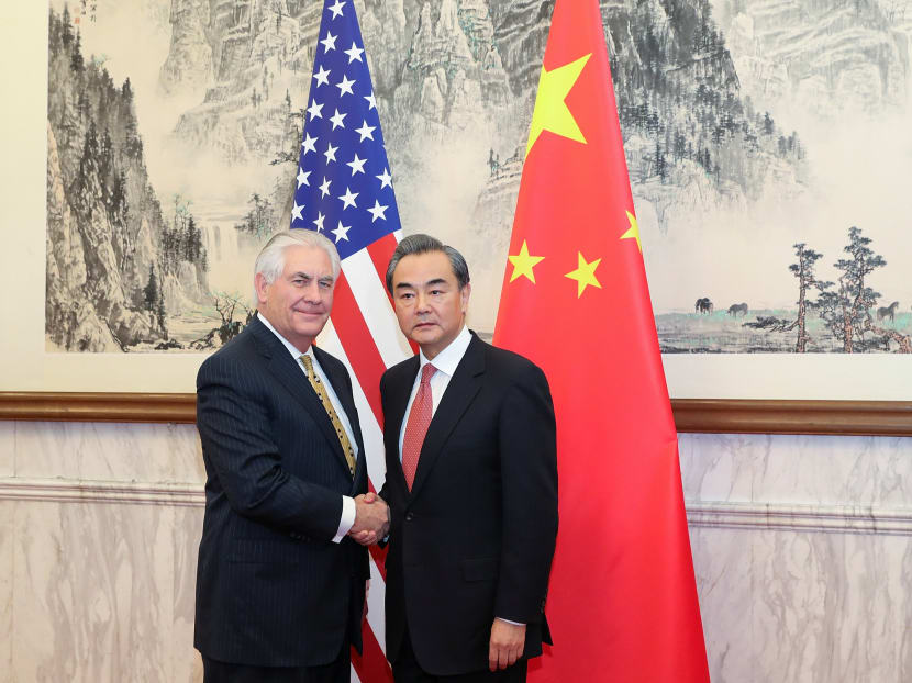 Chinese Foreign Minister Wang Yi (R) shakes hands with U.S. Secretary of State Rex Tillerson at Diaoyutai State Guesthouse on March 18, 2017 in Beijing, China. Photo: Reuters