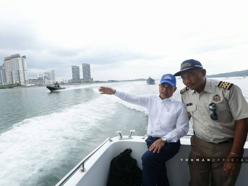 Johor Chief Minister Osman Sapian (left) aboard the MV Pedoman.