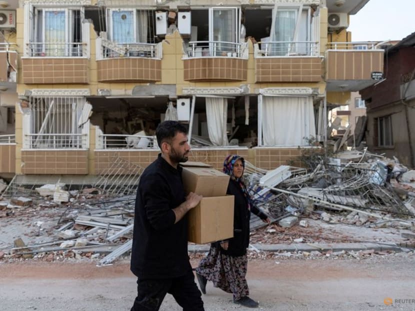 A man holds boxes to contain belongings gathered from their destroyed homes in the aftermath of the deadly earthquake in Antakya, Hatay province, Turkey, February 20, 2023. A man holds boxes to contain belongings gathered from their destroyed homes in the aftermath of the deadly earthquake in Antakya, Hatay province, Turkey, February 20, 2023.