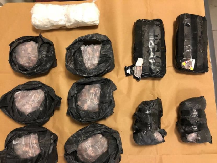 Packs of heroin recovered from the motorcycle of a 35-year-old Malaysian male arrested by the CNB during an operation on Jan 26, 2018. Photo: CNB