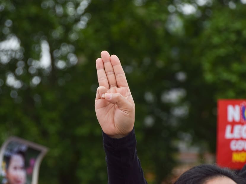 The three-finger salute has frequently been used as a show of resistance by protesters during demonstrations.