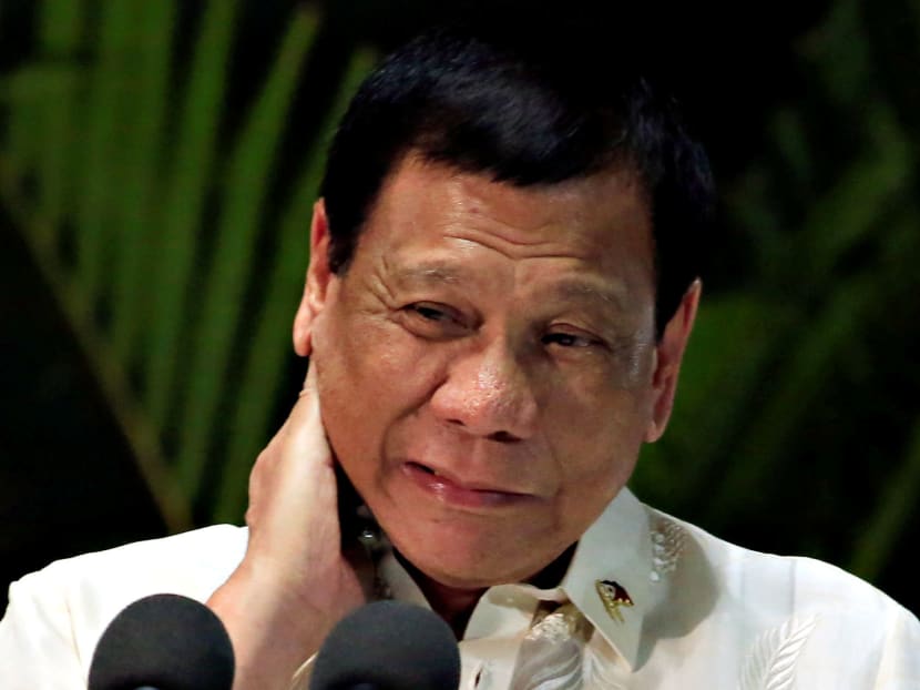 Philippine President Rodrigo Duterte gestures while answering questions during a news conference upon arrival from a trip to Myanmar and Thailand at an international airport in Manila. Photo: Reuters