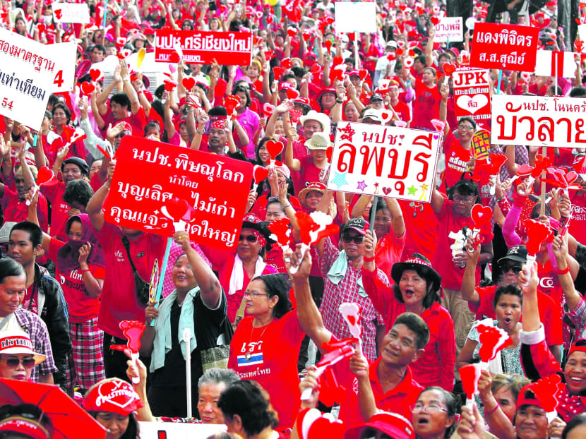 Pro-government Red Shirts rallying on the outskirts of Bangkok yesterday. The government has advised people to stay safe by avoiding protest sites. Photo: REUTERS