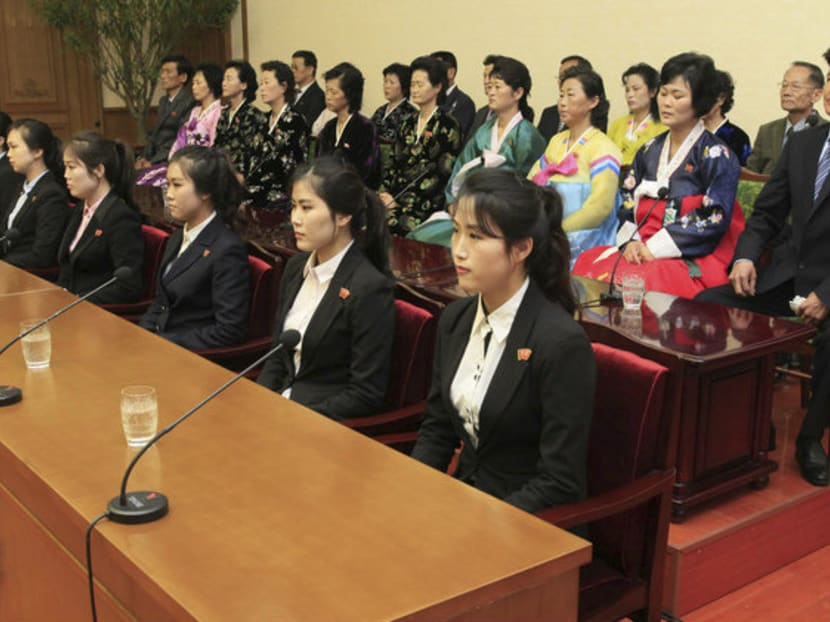 Colleagues and family members of 12 North Korean waitresses are presented to the media in Pyongyang, North Korea on Tuesday (May 03). North Korea is stepping up its calls for South Korea to return 12 waitresses it says were tricked into going to the South. Seoul says the waitresses willingly defected. Photo: AP