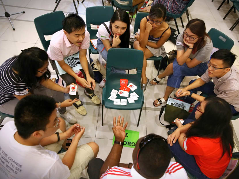 Participants playing 'Singapore in a Box', a card game to set youths thinking about current affairs, during the Post-National Day Rally Dialogue in September. Last year, the Association for Public Affairs surveyed 244 student leaders for their views on how Singapore was faring. Photo: Nuria Ling Participants playing 'Singapore in a Box', a card game to set youths thinking about current affairs, during the Post-National Day Rally Dialogue in September. Last year, the Association for Public Affairs surveyed 244 student leaders for their views on how Singapore was faring. Photo: Nuria Ling