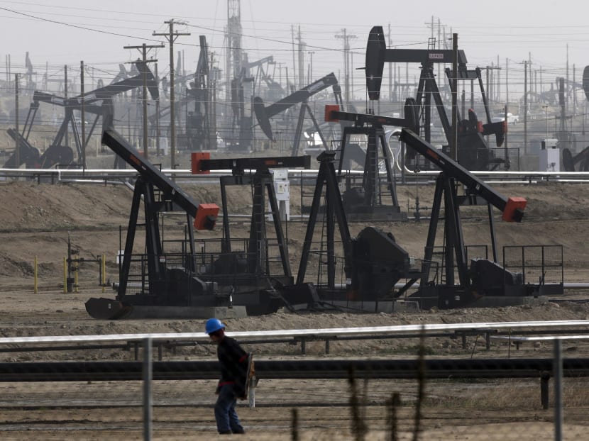 Pumpjack operating in an oilfield: The price of oil dipped again on Monday, but traders are pinning their hopes on a tightening global market. Photo: AP