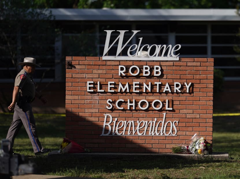 An officer walks outside of Robb Elementary School in Uvalde, Texas, on May 25, 2022. An officer walks outside of Robb Elementary School in Uvalde, Texas, on May 25, 2022.