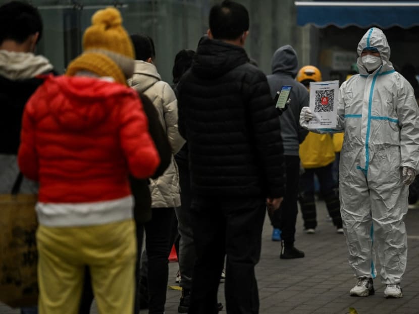 This file photo taken on Nov 20, 2022 shows people queueing to test for the Covid-19 coronavirus at a swab collection station in Beijing. This file photo taken on Nov 20, 2022 shows people queueing to test for the Covid-19 coronavirus at a swab collection station in Beijing.