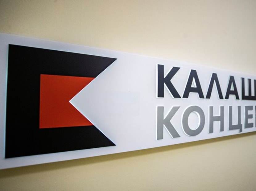 A board with the logo of Russian arms manufacturer Kalashnikov is on display in an office in Moscow, Russia February 8, 2021. Picture taken February 8, 2021. REUTERS/Maxim Shemetov/File Photo