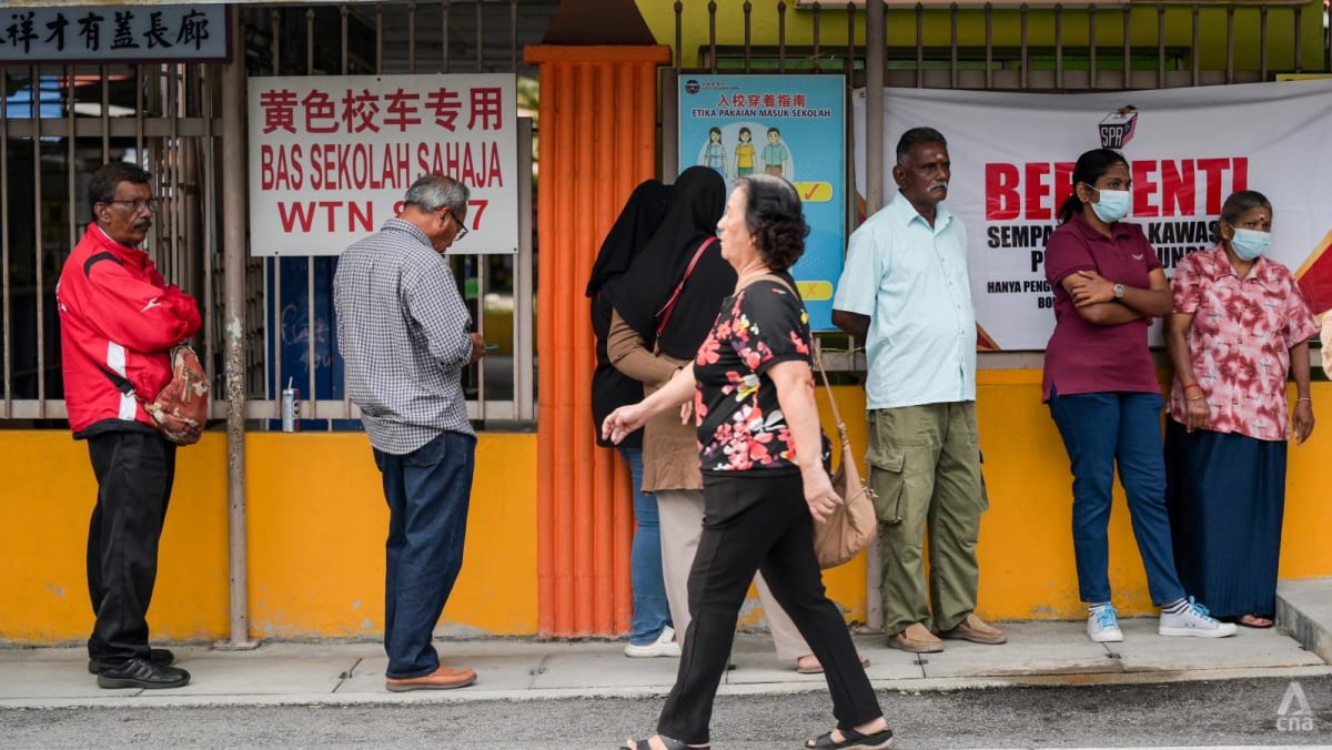 Hopes, frustration and resolve on display as voting kicks off to a slow start in Malaysian state polls
