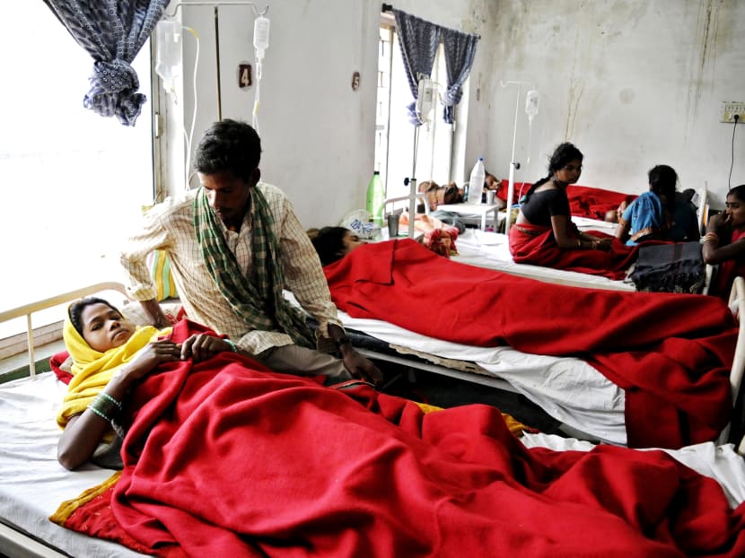 Women who had undergone sterilisation surgeries receiving treatment at the District Hospital in Bilaspur in the Indian state of Chhattisgarh on Nov 12. At least a dozen have died and many others fallen ill following similar surgeries. Photo: AP