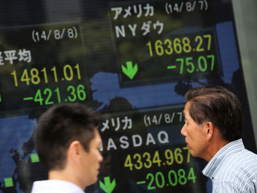 Major Asian bourses opened lower following the overnight decline on Wall Street. Japan’s Nikkei-225 led the slide by plunging 3 per cent. PHOTO: AP