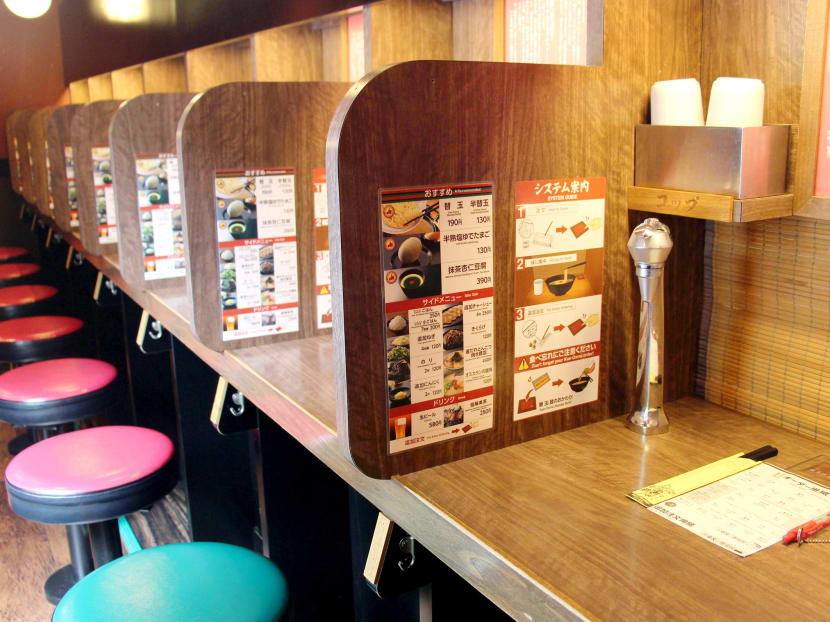 Ichiran Ramen’s private dining booths are targeted at patrons who value privacy and minimal human interaction.  Photo: Kyodo News