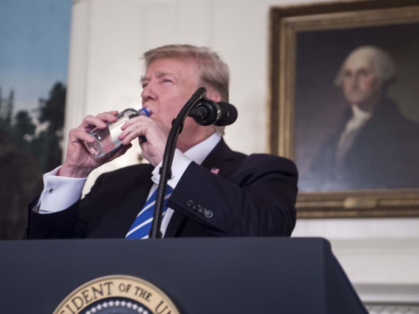United States President Donald Trump takes a drink of water as he speaks about his recent trip to Asia. Mr Trump says his “America First” foreign policy had restored strength and respect to the US on the world stage. Photo: AFP